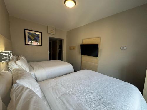 Un ou plusieurs lits dans un hébergement de l'établissement Holiday Inn Express & Suites - Atlanta Downtown by IHG