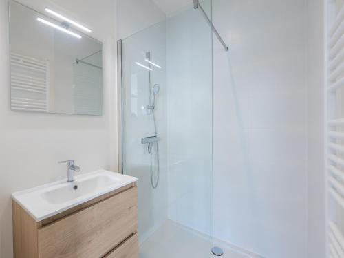 a bathroom with a sink and a shower at Short text for EN is not available in Middelkerke