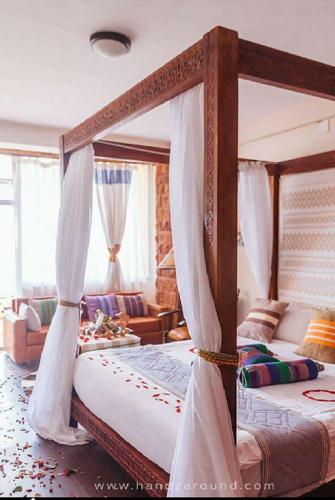 a bedroom with two bunk beds and a living room at Maribela Hotel in Lalibela