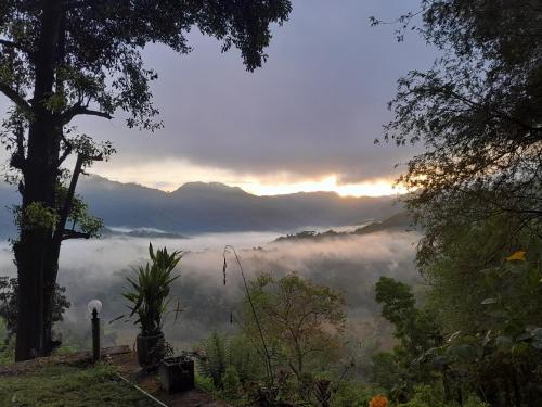a view of a misty valley in the mountains at Eco Leisure Kadugannawa Reach in Mawanella