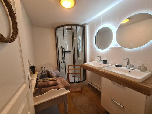 a bathroom with two sinks and a shower at Détente au Moulin: Piscine, Jacuzzi, Animaux Bienvenus - FR-1-591-641 in Rouvres-les-Bois