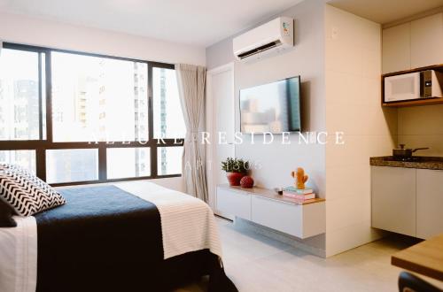 Televisyen dan/atau pusat hiburan di Flat Luxo Boa Viagem Allure 1305