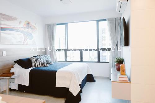 Katil atau katil-katil dalam bilik di Flat Luxo Boa Viagem Allure 1305