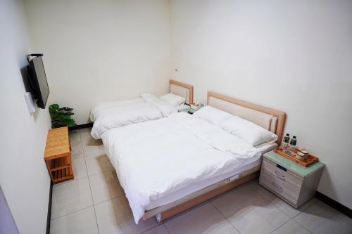 Postel nebo postele na pokoji v ubytování 芹壁五家村民宿