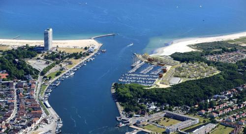 an aerial view of a river next to a beach at Landal Travemünde in Travemünde