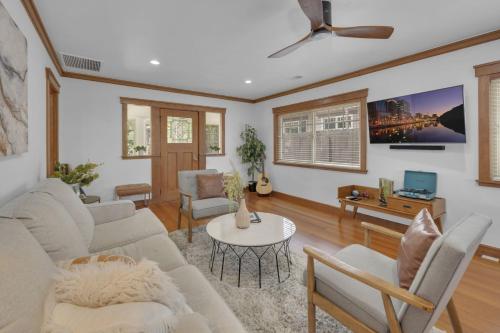 a living room with a couch and a table at Near All Things SD - Canyonview - Jacuzzi - EV Charge in San Diego
