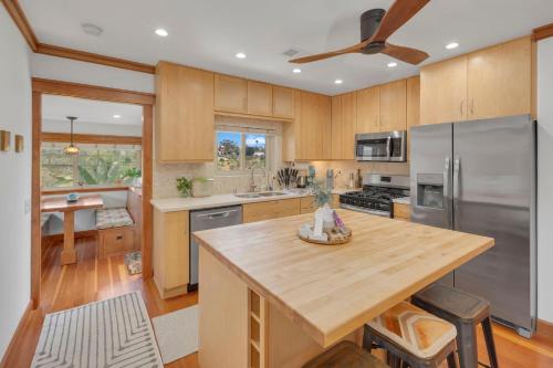 a kitchen with wooden cabinets and a wooden counter top at Near All Things SD - Canyonview - Jacuzzi - EV Charge in San Diego