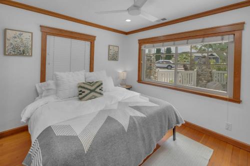 a bedroom with a large bed and a window at Near All Things SD - Canyonview - Jacuzzi - EV Charge in San Diego