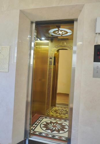 a hallway with a mirror in a building at Ngo - The Gallery Hotel Dalat in Da Thanh