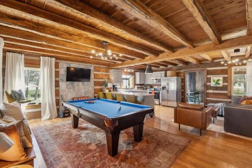 a living room with a pool table in it at Cozy Lux Cabin With Game Room in Murfreesboro
