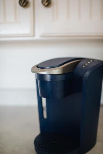a black toaster sitting on top of a counter at Chapman House in Put-in-Bay