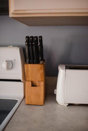 a knife block sitting on a counter next to a stove at Chapman House in Put-in-Bay