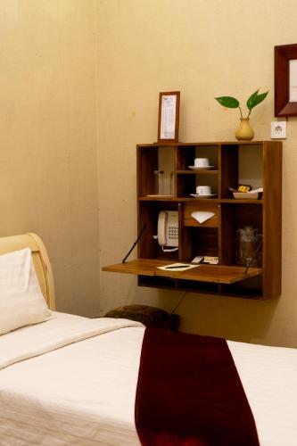 Postel nebo postele na pokoji v ubytování Kayu Arum Resort