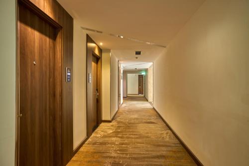 an empty hallway with a long corridor at PANAMA Nha Trang Hotel in Nha Trang