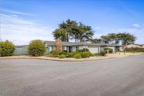 a house on a street with a driveway at STR25-15 Private Room in Marina