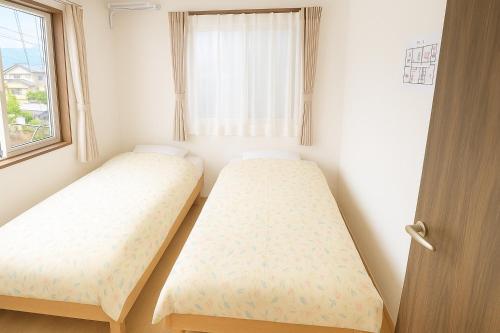 Fujiyama Stay100にあるベッド