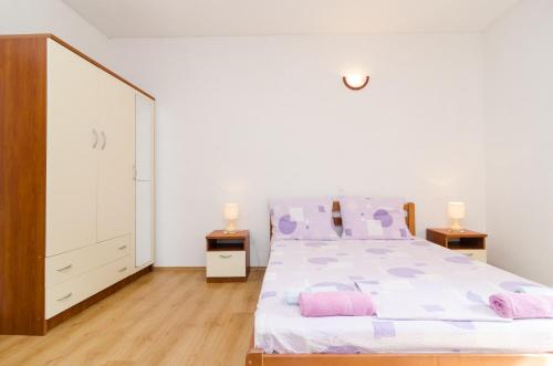 Ένα ή περισσότερα κρεβάτια σε δωμάτιο στο Apartments Limuni
