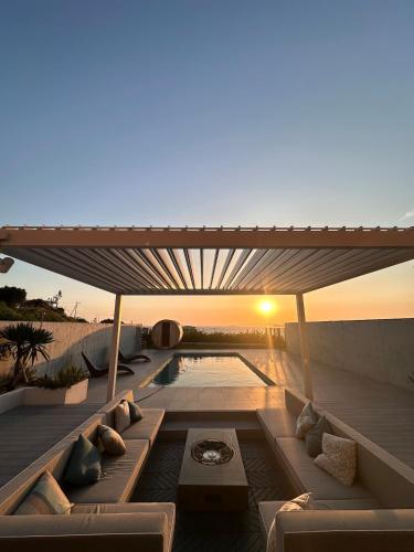 a view of a patio with a couch and a pool at Gold Valley Villa B in Futtsu
