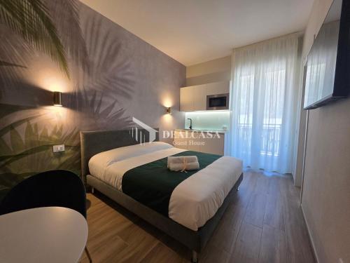 a bedroom with a bed with two bags on it at DEALCASA Guest House in Nuoro