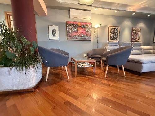 a living room with a couch and chairs and a table at Blue Stella Luxury Apartment in Split