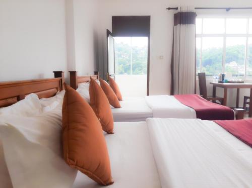 Postel nebo postele na pokoji v ubytování Terrace Kandy