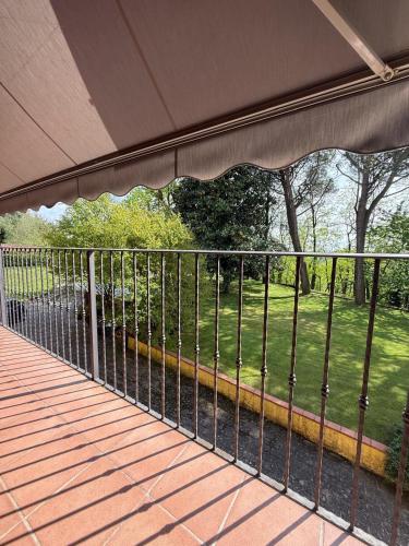 a porch with a view of a field of grass at Casa Gioja in Vizzola Ticino