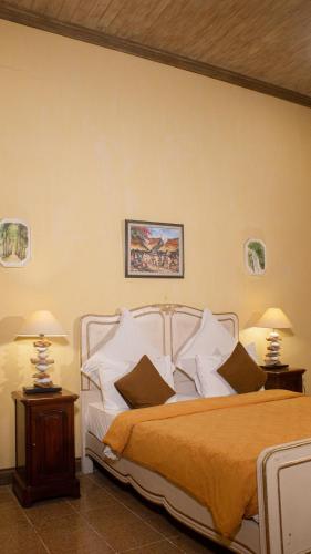 Postel nebo postele na pokoji v ubytování Kayu Arum Resort