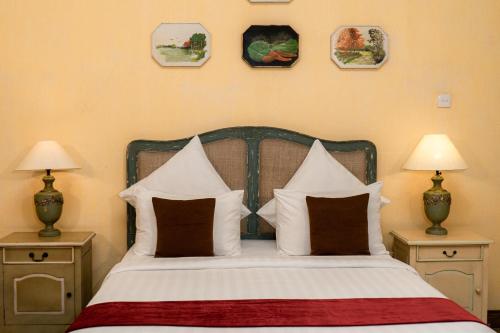 Postel nebo postele na pokoji v ubytování Kayu Arum Resort