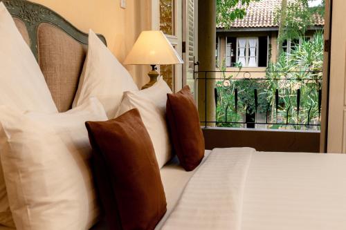 Postel nebo postele na pokoji v ubytování Kayu Arum Resort
