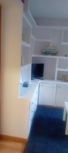 a white desk with a laptop on top of it at Apartamento en Formigal in Formigal