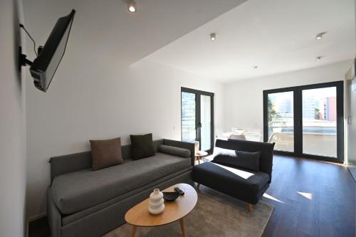 Posezení v ubytování Lugano Suite Modern Concept 4