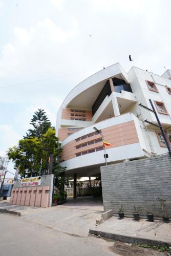 a large building with at Hotel Grand Bee , Yeshwanthpur Junction in Bengaluru