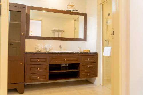 a bathroom with a sink and a mirror at Nice Dream Villas in Da Lat