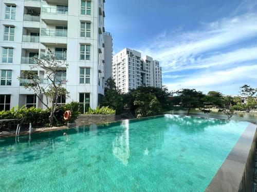 a large swimming pool in front of a building at Lush Lakeside - Citra Luxury Apartments in Jakarta