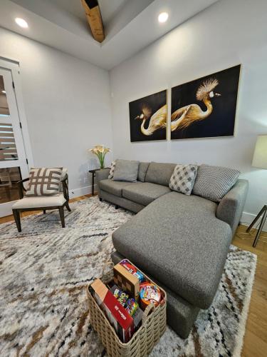 a living room with a couch and a chair at Roxell Ranch-A Country Retreat 12 Guests 6 beds in Brenham