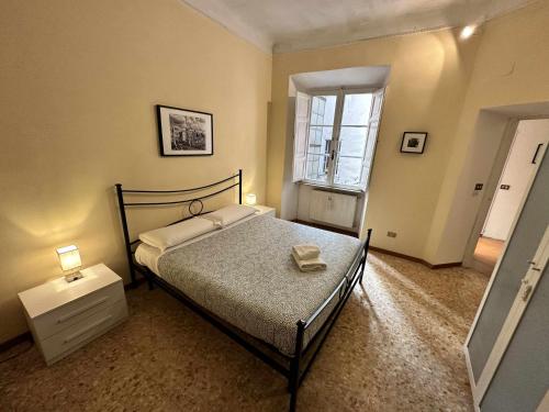 A bed or beds in a room at Rhome Holiday Mameli