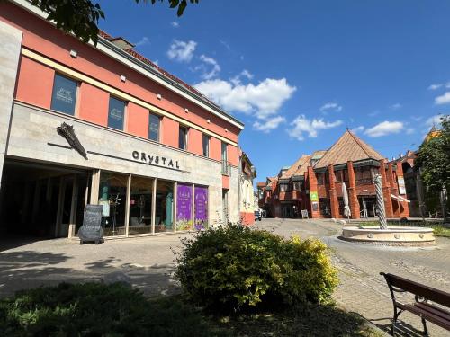 an empty street in a town with buildings at CENTRUM APARTMAN - Citrom utca in Pécs