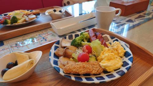 a bowl of food on a table with a plate of food at Bestime B&B in Jiji