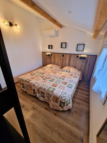a bedroom with a bed in a room at Hotel La Reserve in Vic-la-Gardiole