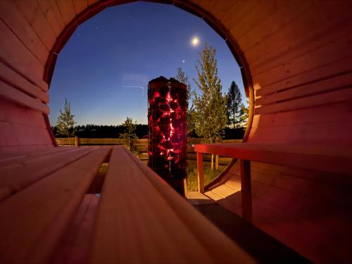an inside view of a wooden iguana with christmas lights at Monialuki in Nogat