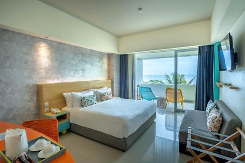 Postel nebo postele na pokoji v ubytování Tijili Hotel Benoa
