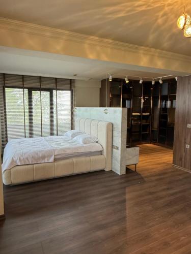 a bedroom with a large bed in a room at villa trapeza in Trabzon