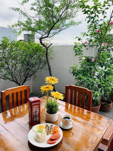 a wooden table with a plate of food on it at The Seaside Residences in Manila