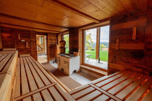 a room with a stove and a window in a cabin at Hotel Restaurant Krone & Wellness - Schopfheim in Schopfheim