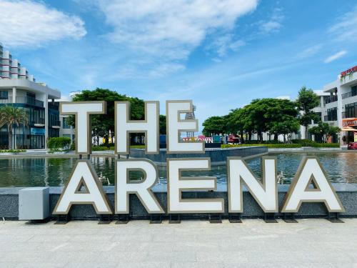 a large sign that reads fire america in front of a fountain at The AZURE Arena Cam Ranh Resort in Thôn Hò Ða