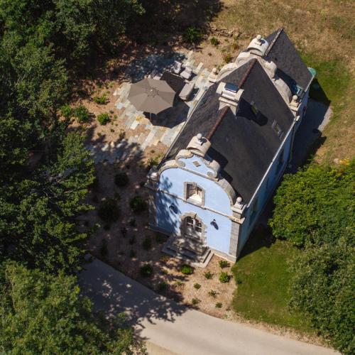 an overhead view of a house with a church at Domaine de Locguénolé & Spa - Relais & Chateaux in Kervignac