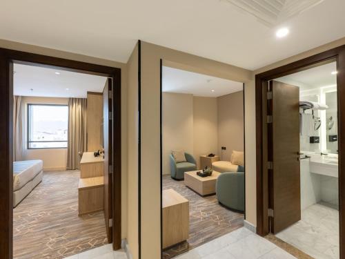 a hotel room with a view of a living room at فندق عمرية in Al Madinah