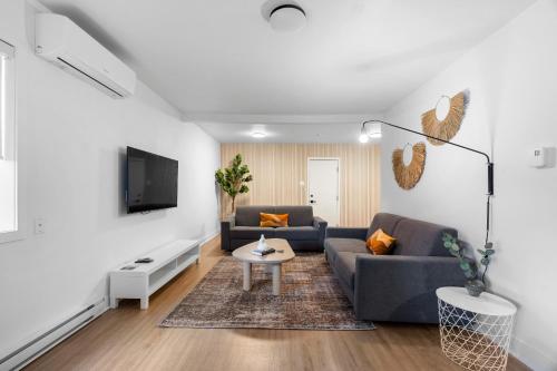 Uma TV ou centro de entretenimento em Hotel Laurence