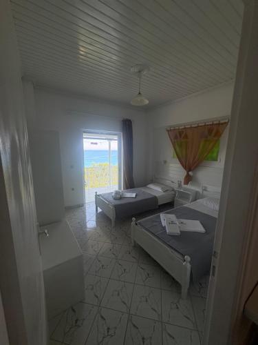 Ένα ή περισσότερα κρεβάτια σε δωμάτιο στο VILLA AGIA AIKATERINI