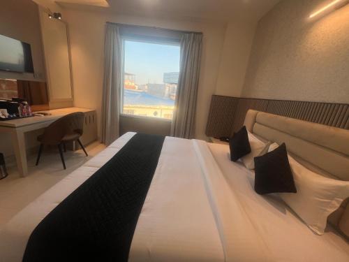 Postel nebo postele na pokoji v ubytování Hotel Glorious Grand